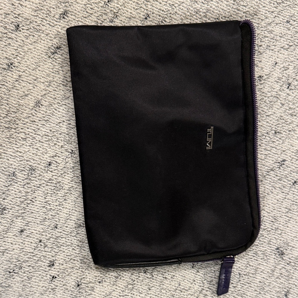 Tumi Black Toiletry Bag with Purple Zipper